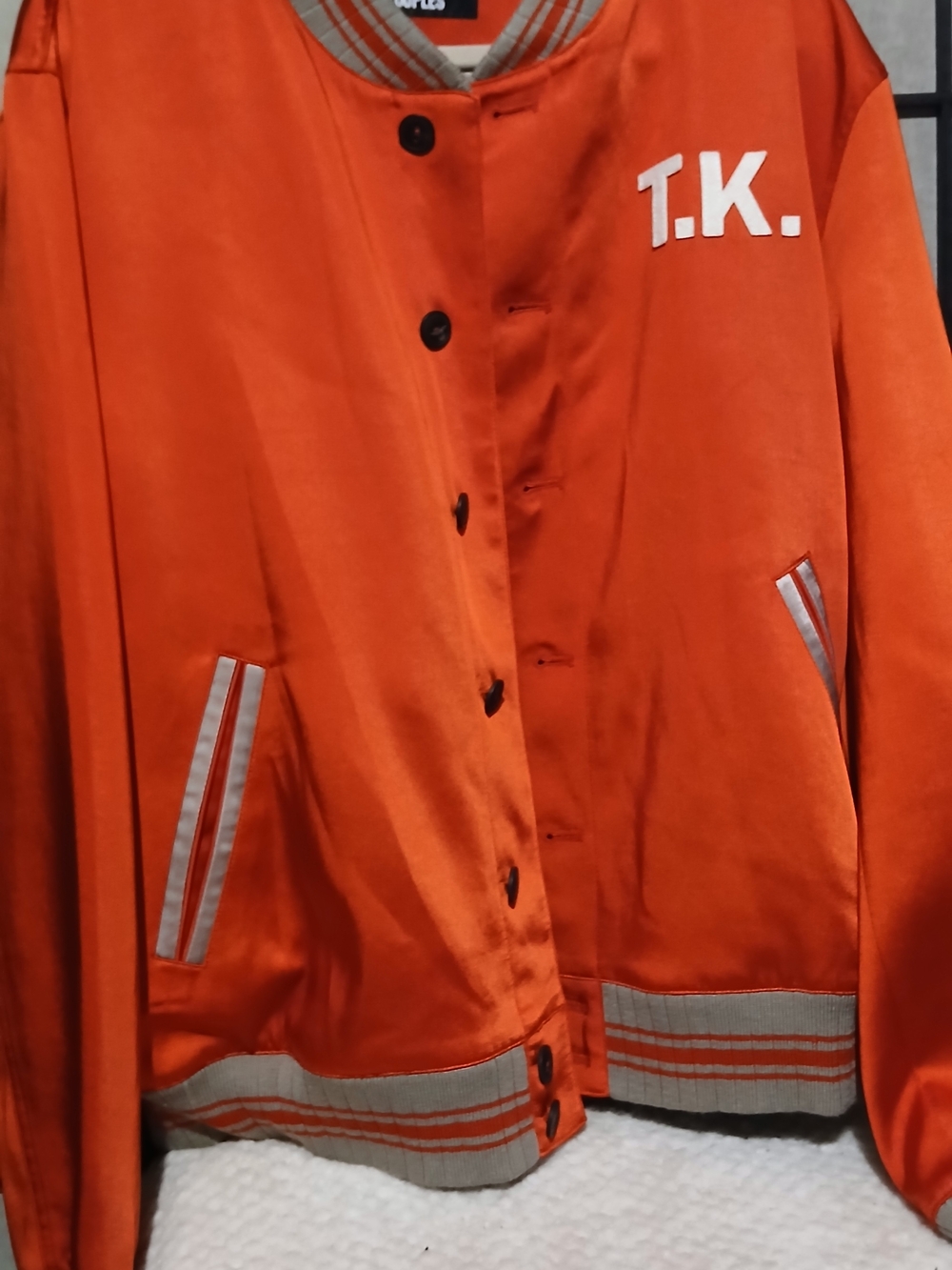 The KooplesReddish Orange Satin Bomber Jacket with T.K. Logo